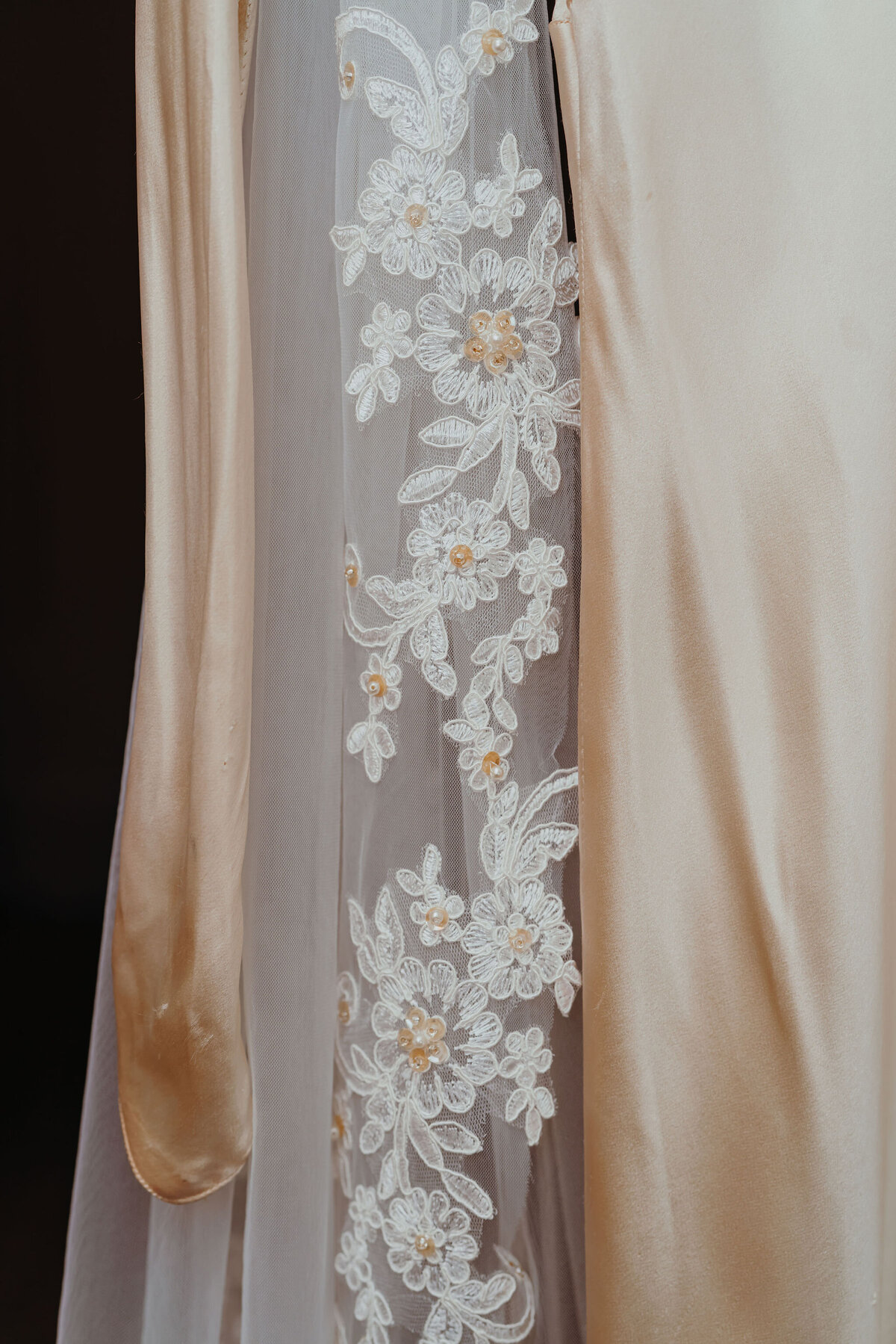 close up of lace stitching on a wedding dress