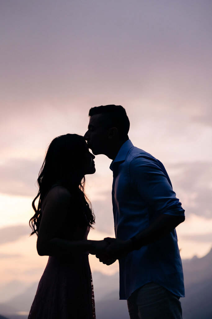 Romantic couple enjoying a scenic mountain view, captured by Lorissa Lee Photography. Featured on Brontë Bride.