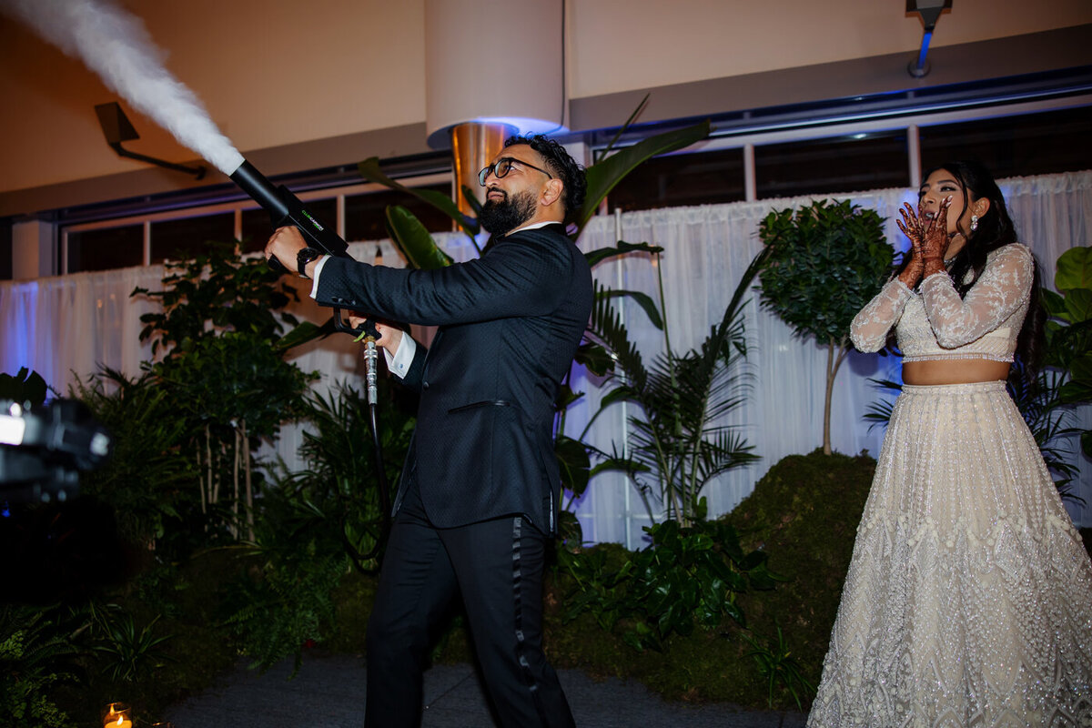 Bride and groom celebrating during wedding reception.