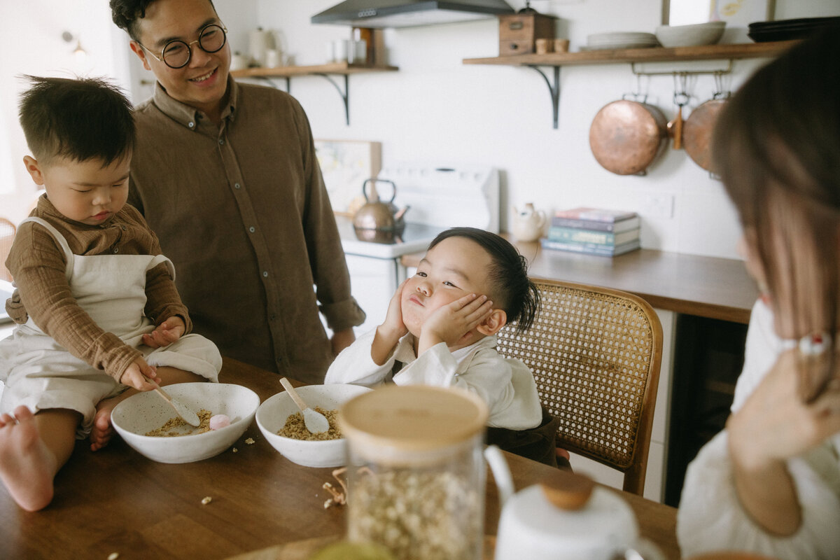 Parent and child enjoying breakfast together, authentic connection during a Sydney family photoshoot