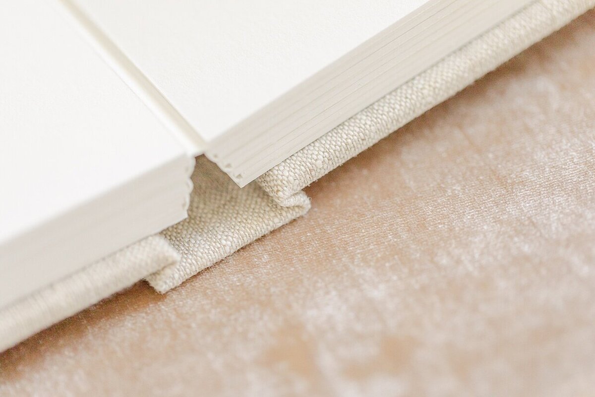 A close up of the binding for an heirloom album available for purchase after your Indianapolis boudoir pictures.