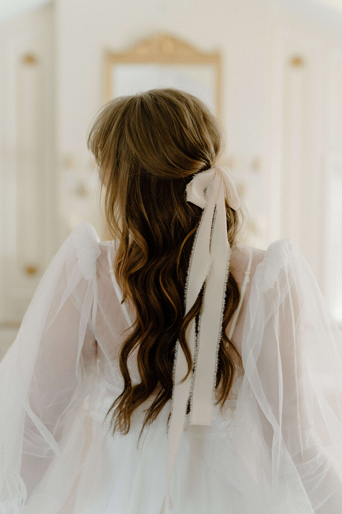 brides long hair with bow