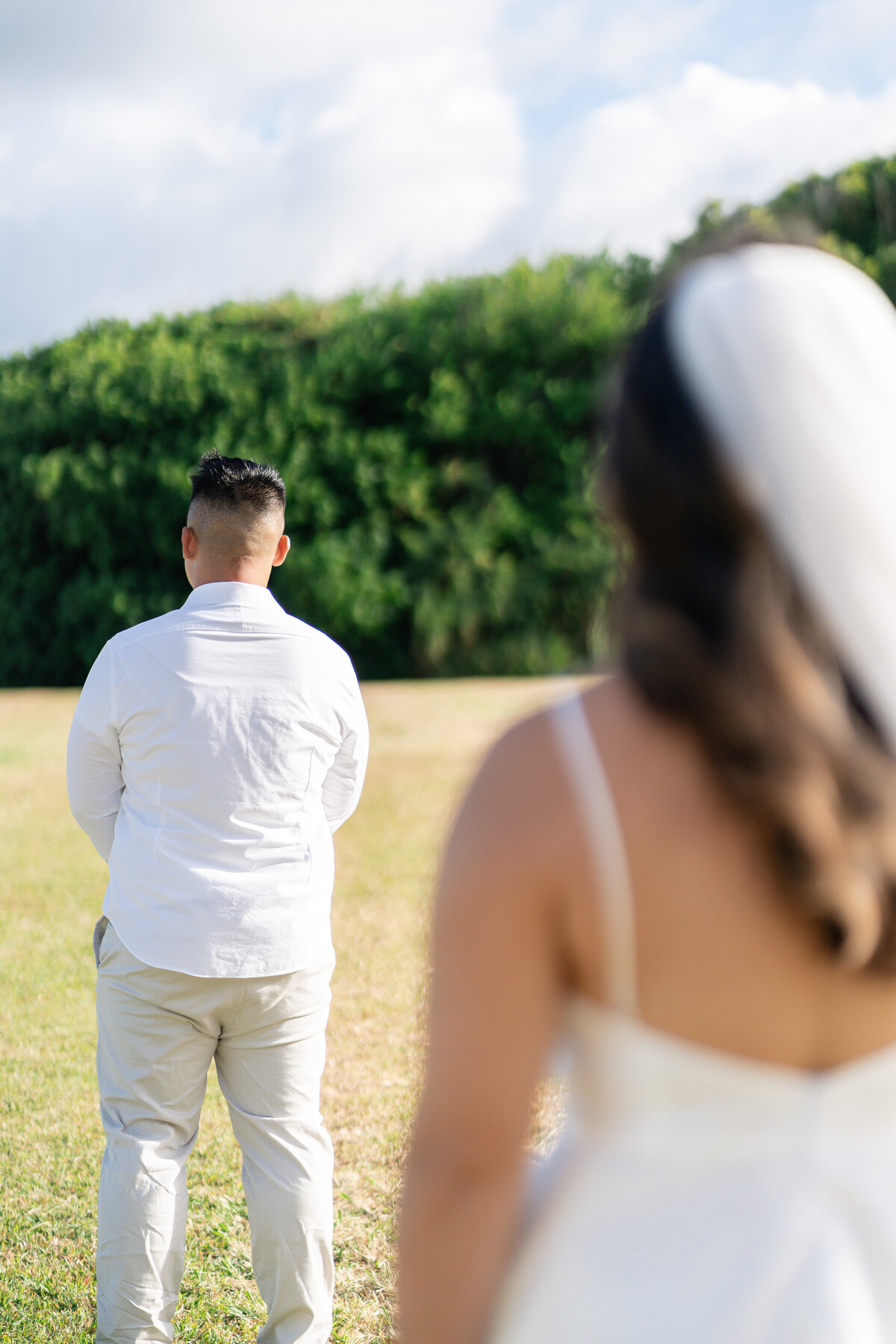 Oahu Hawaii Elopement First Look with Asian couple at Kualoa Regional Park.