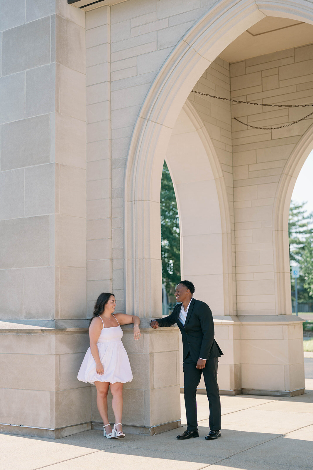 Close-up of couple holding hands showing engagement ring during Kalamazoo engagement session.
