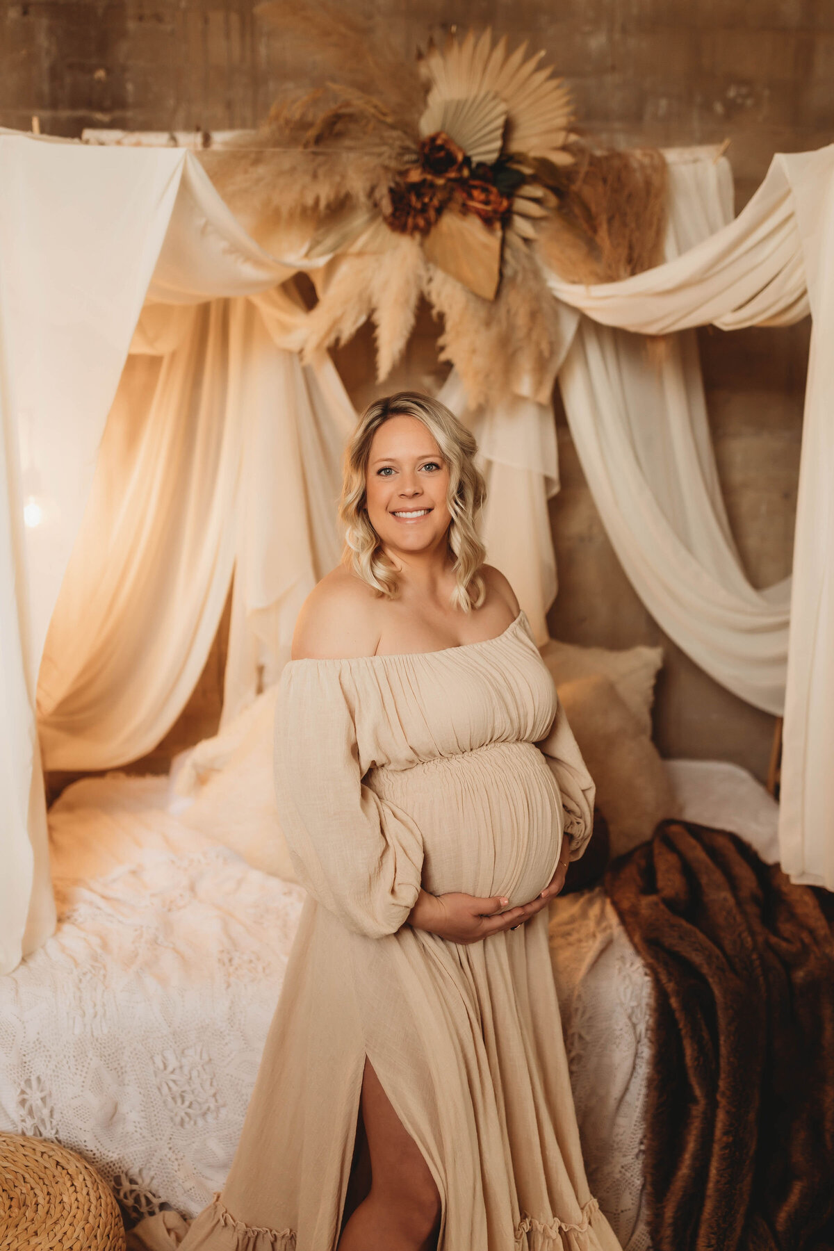 pregnant mother in a long dramatic linen dress in a dallas studio