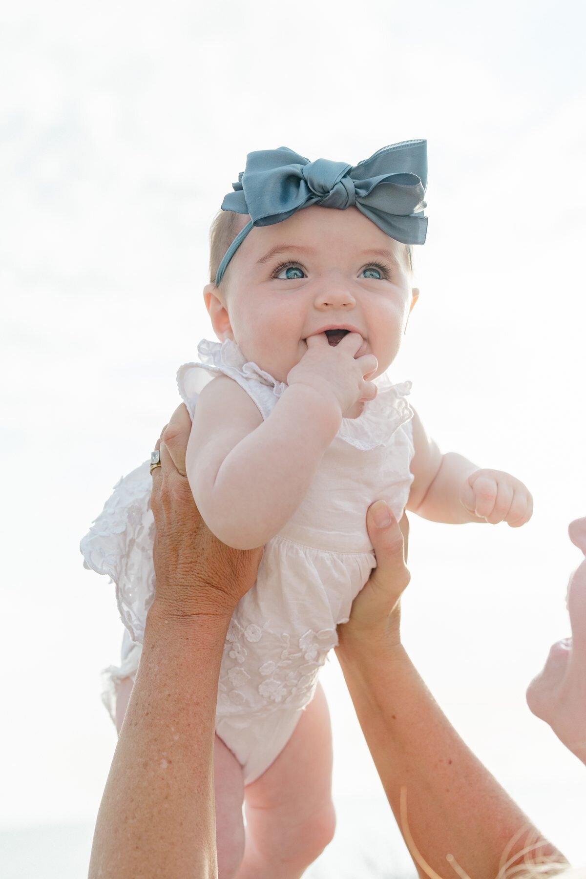 Del mar photographer captures baby girl during family photoshoot