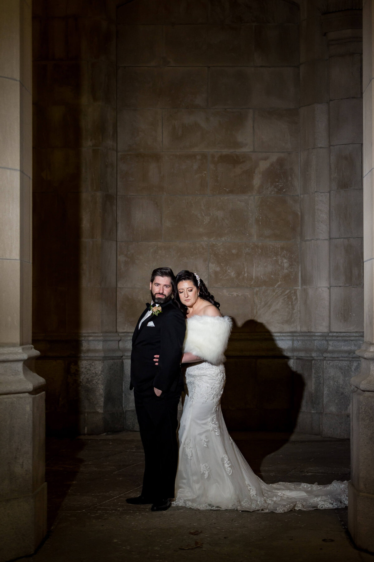 Ottawa wedding photography of a bride in a white dress and a groom in a black tux outside the Chateau Laurier hotel