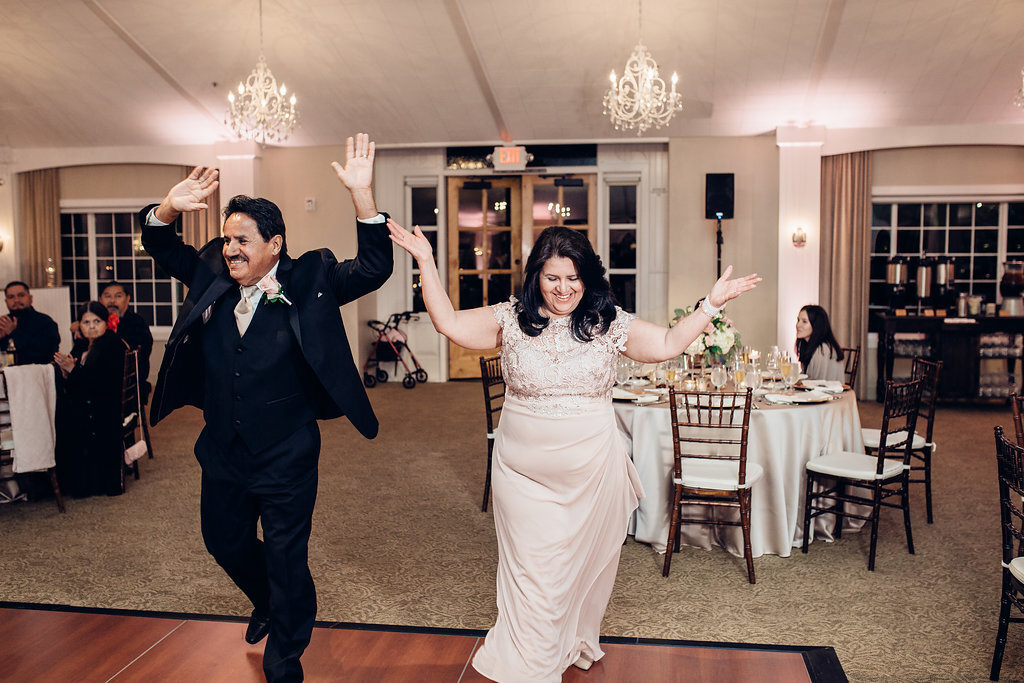 Wedding Photograph Of Man And Woman Raising Their Hands Los Angeles