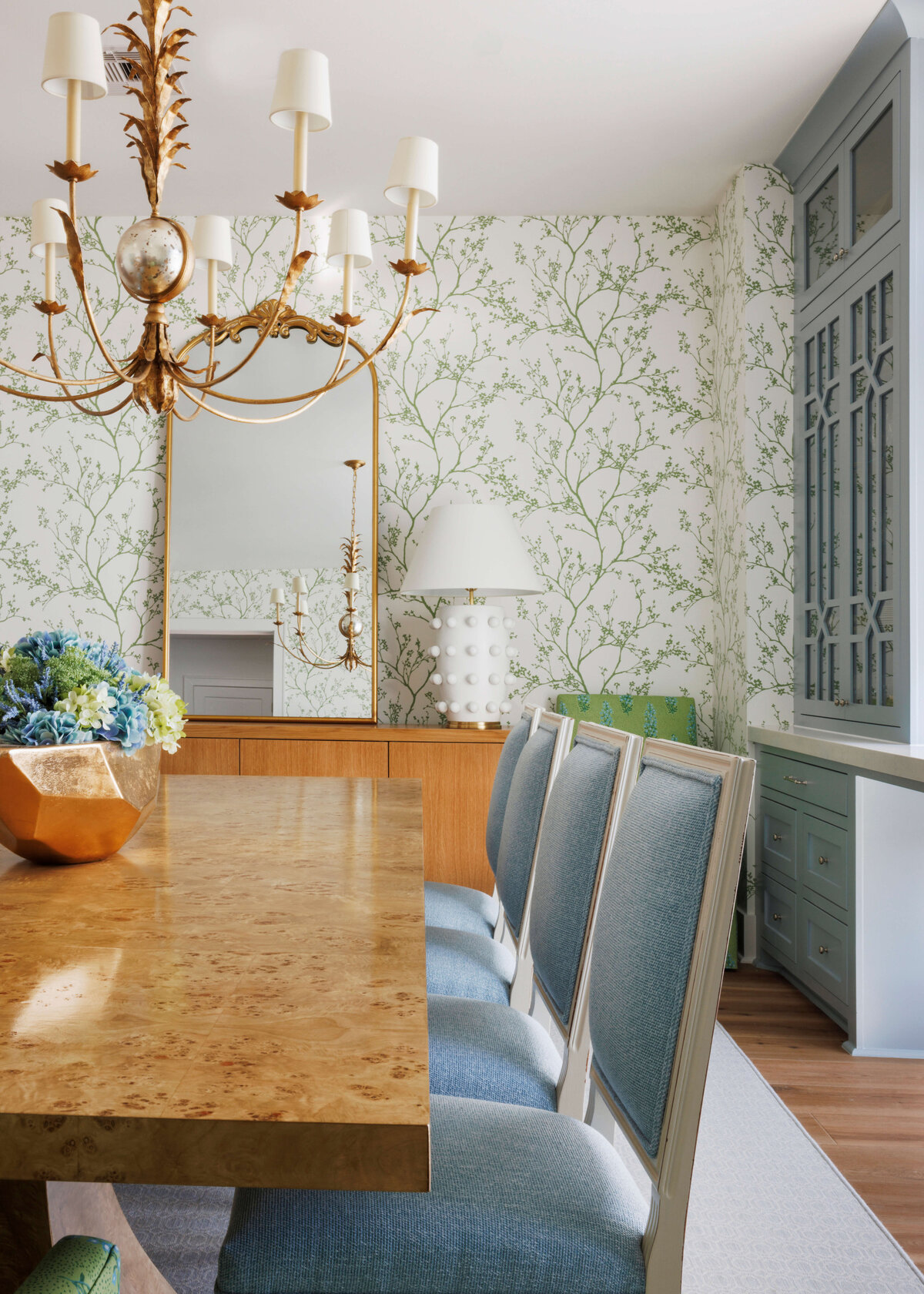 oyster creek studios lighthouse on the lake blue cushioned chairs around a wooden table in dining room