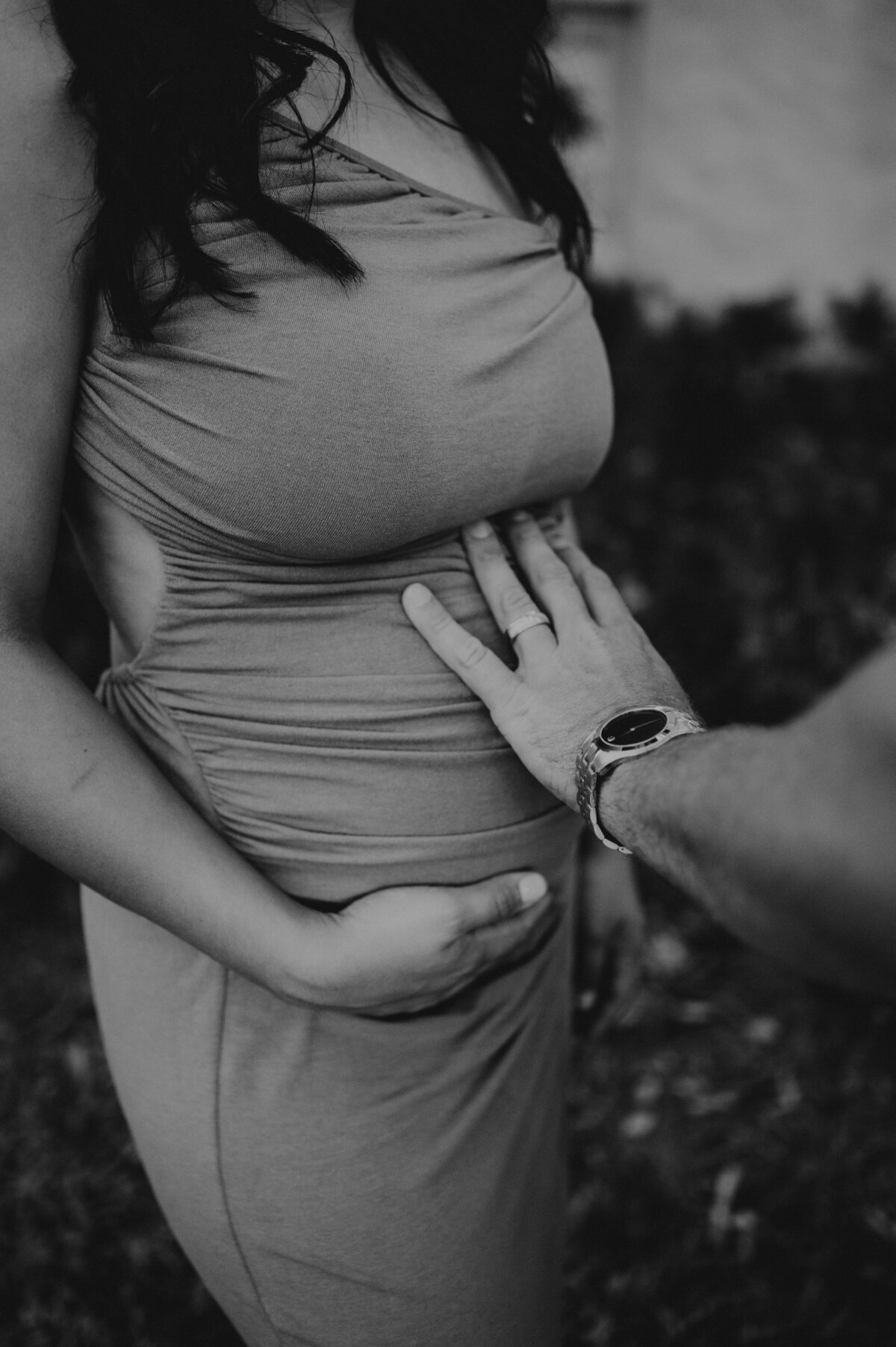 guy touching pregnant belly during maternity session