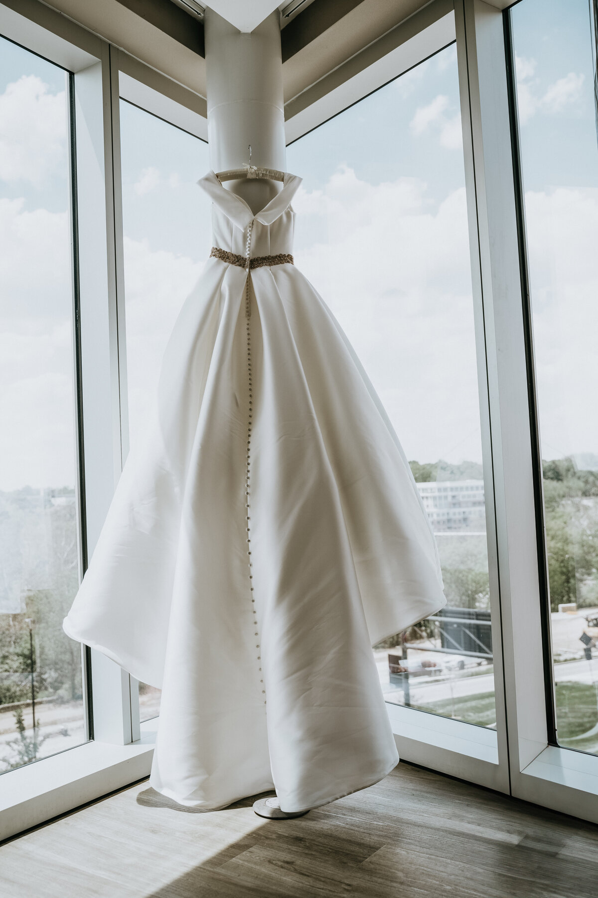 Dress hung in window in Columbus
