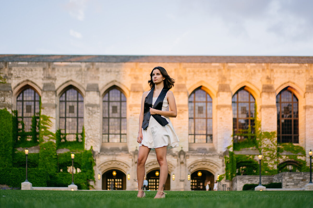Northwestern University graduate standing in front of Deering Library