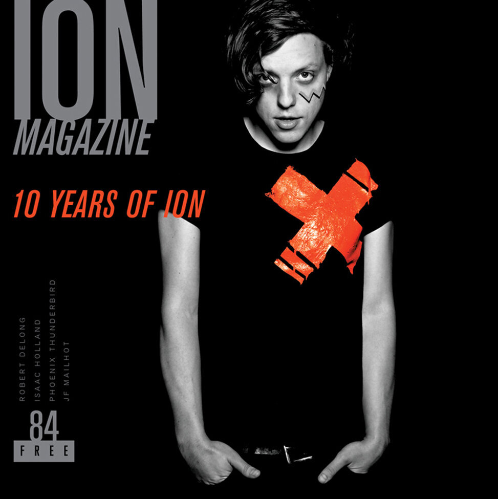 Magazine Cover Publication Ion featuring musician Robert Delong standing with hands in pockets in front of black backdrop