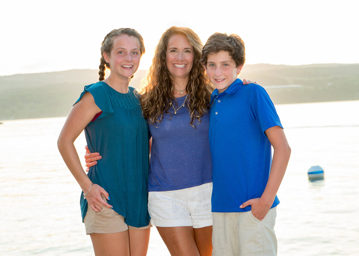 Mother and two teenage children family portrait on Canandaigua Lake in the summer