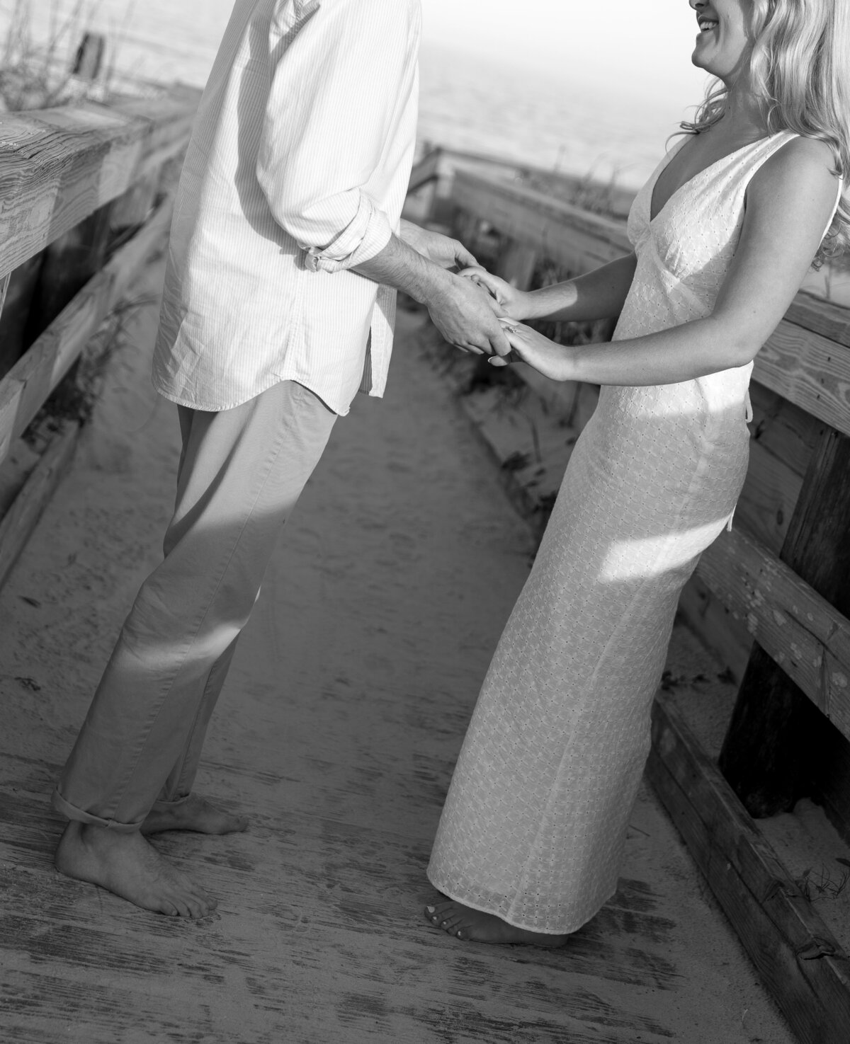 Bride and Groom holding hands on the beach by film wedding photographer Shelby Ann Photos
