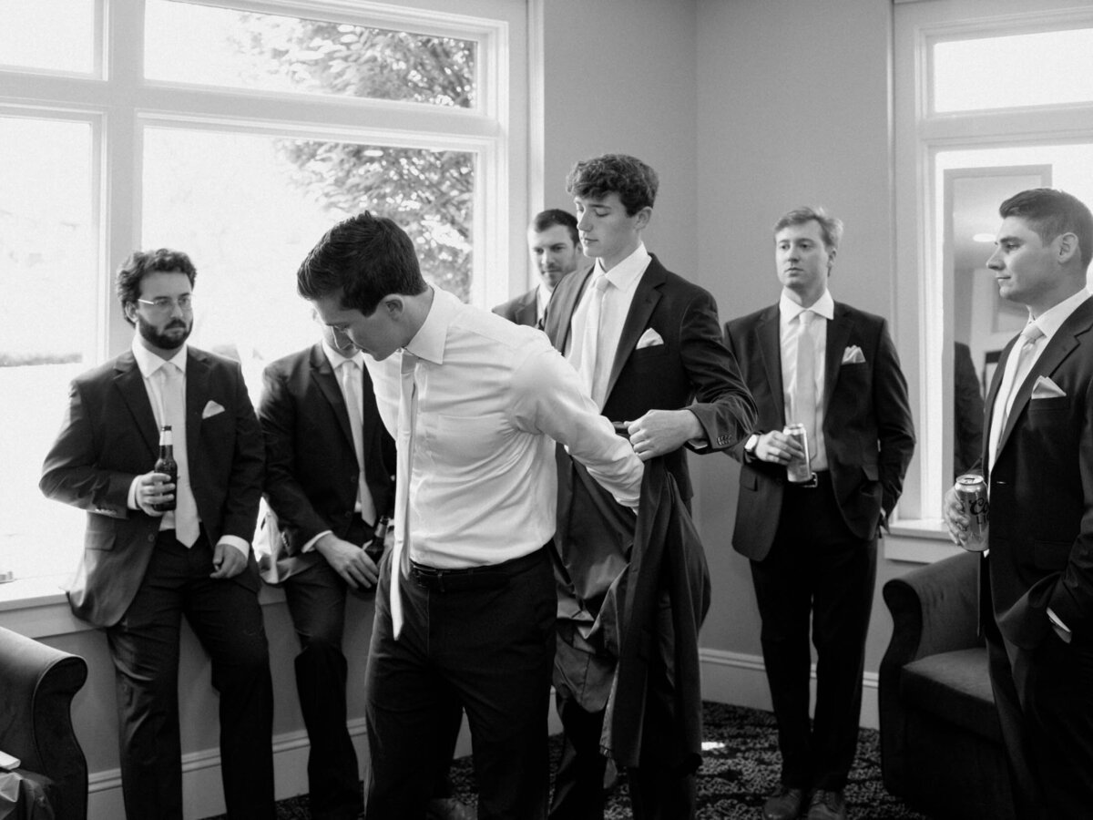 Groom getting ready with groomsmen at Cleveland Yachting Club