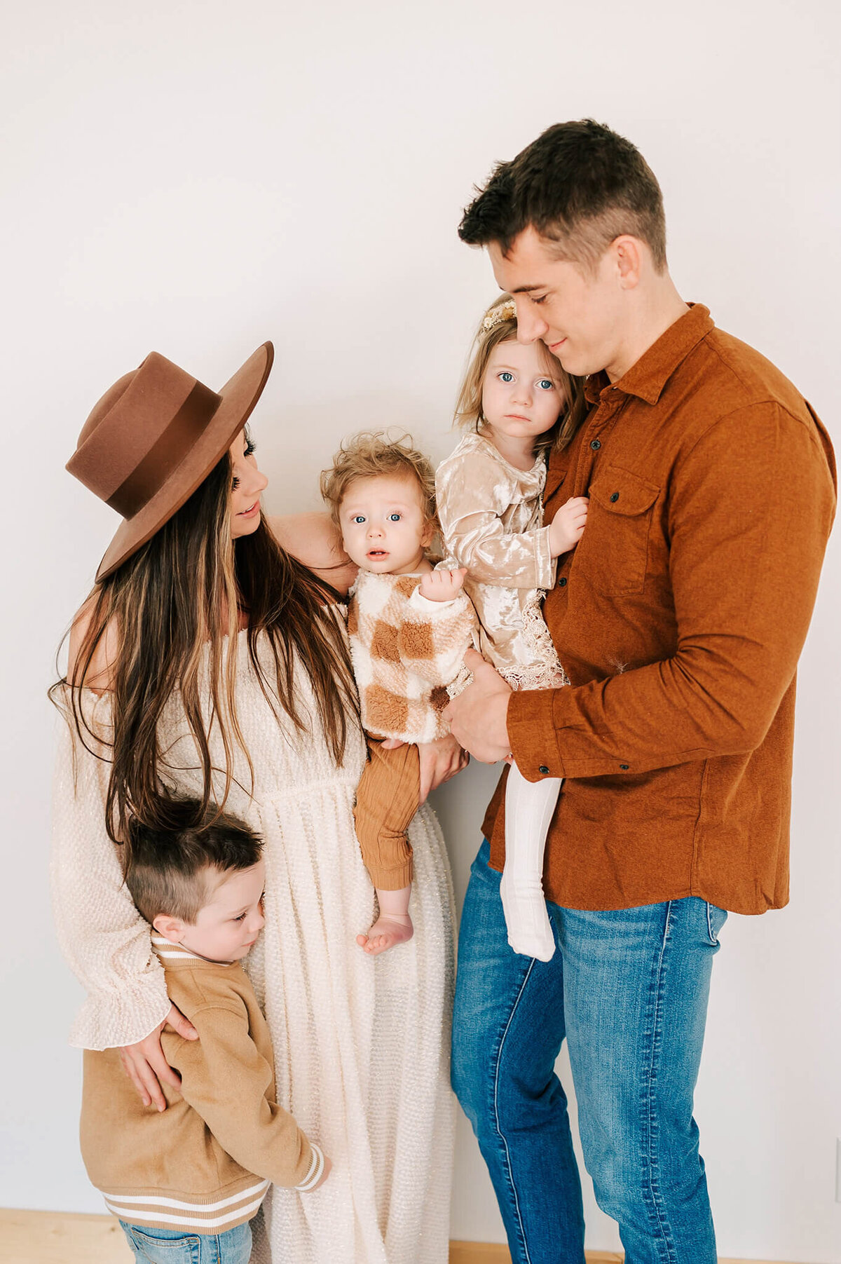 parents hugging kids during Branson MO family photography session