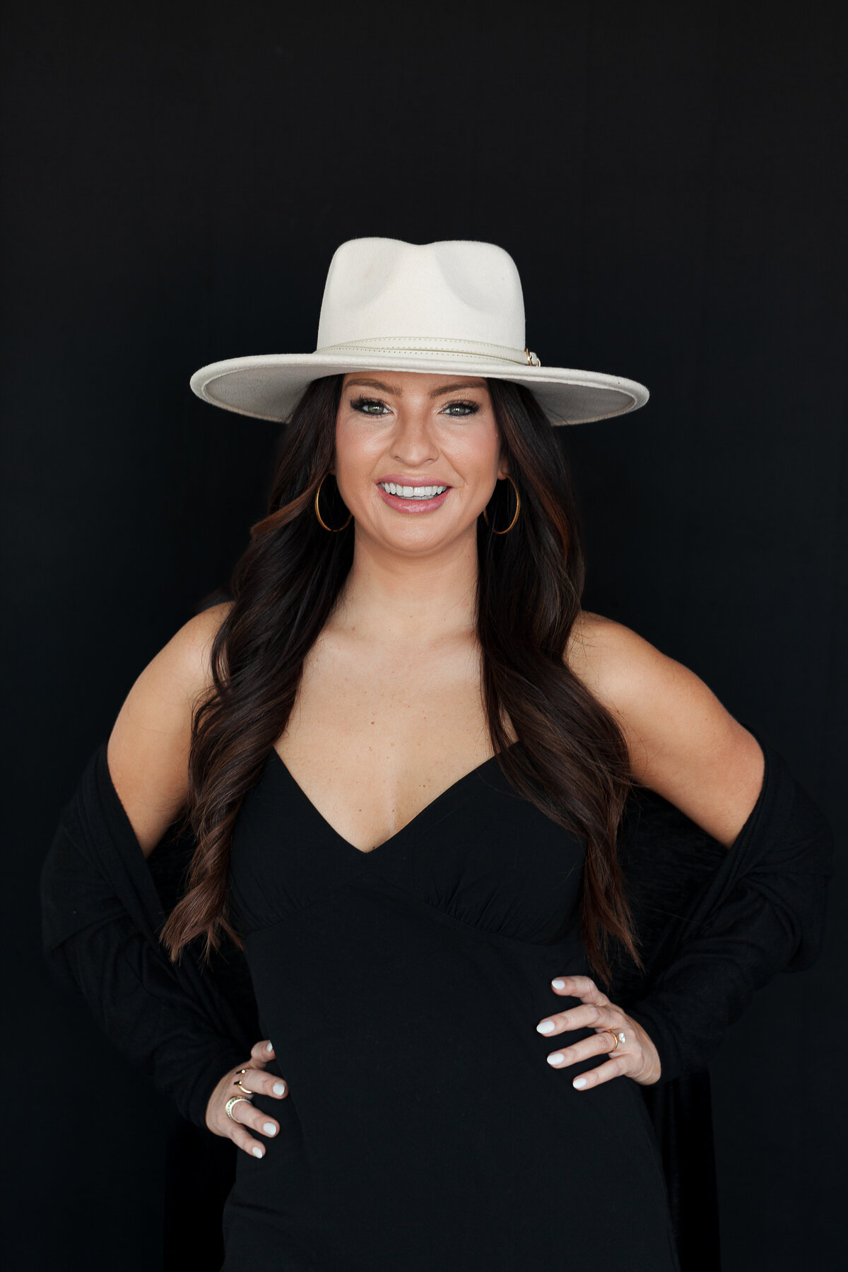 woman-power-pose--headshot-black-dress-black-background-hat-for-brand-session-the-frame-charlotte