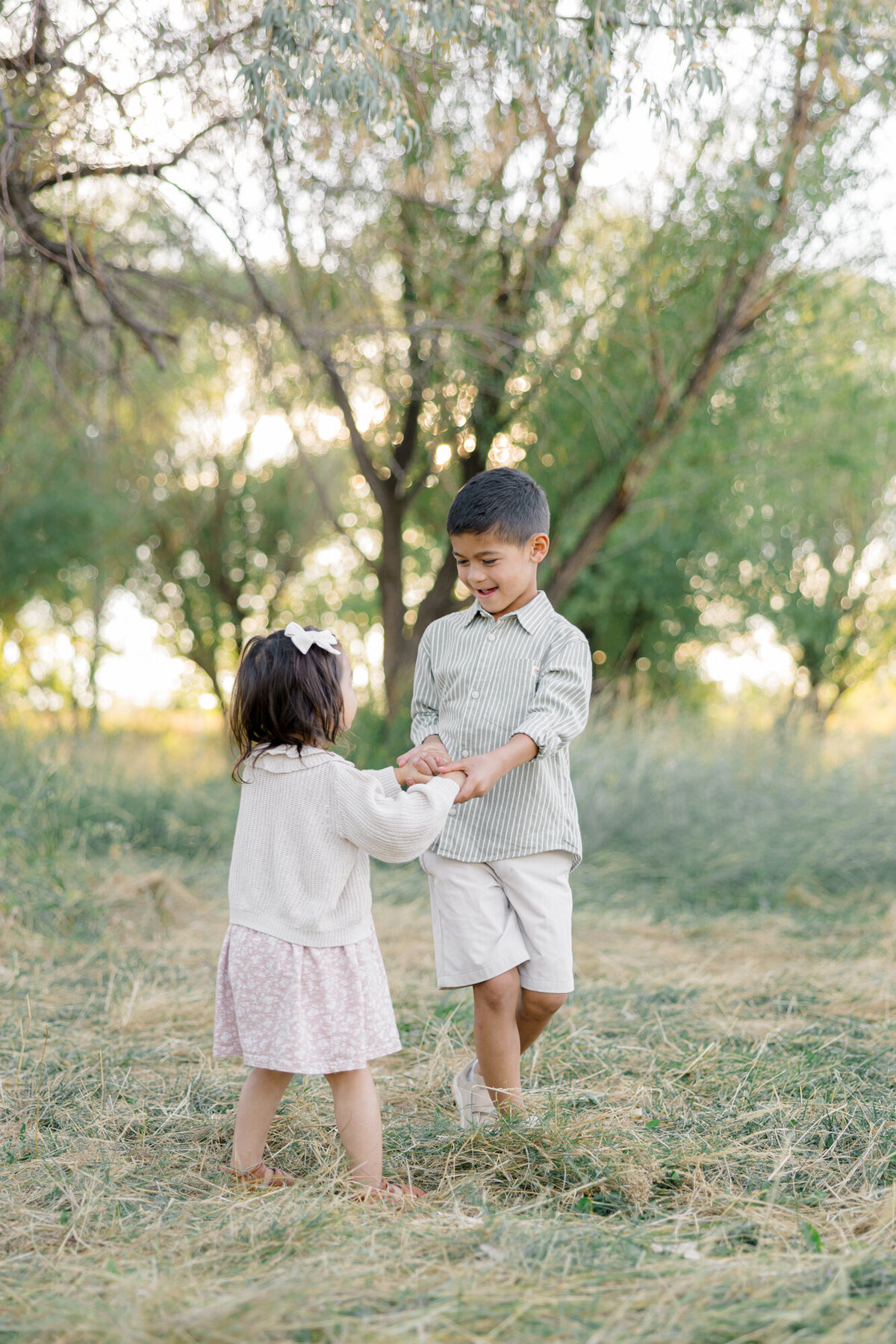 sibling holding hands
