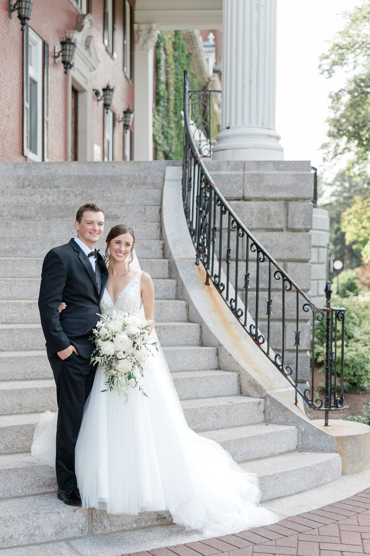 A bride and groom in black tie attrire