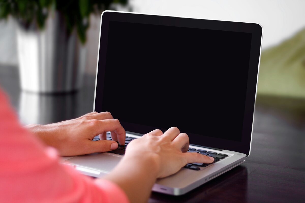 A person is working on a laptop.
