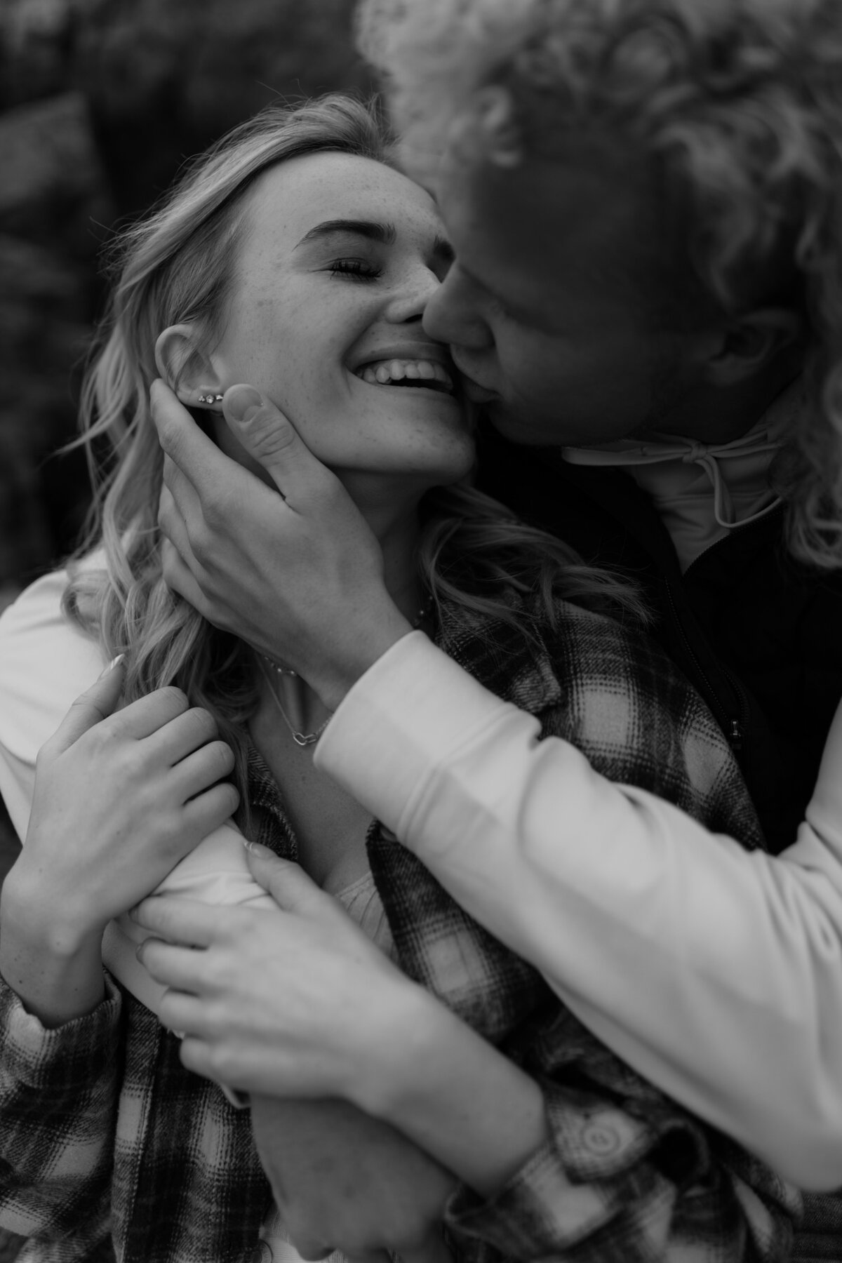 black and white image couple kissing