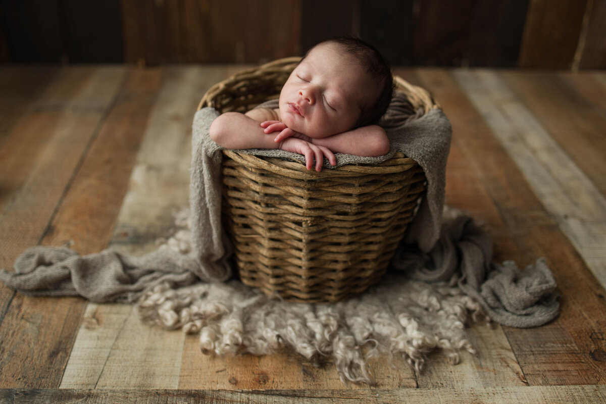Newborn Baby Boy In Basket with Neutral Colors