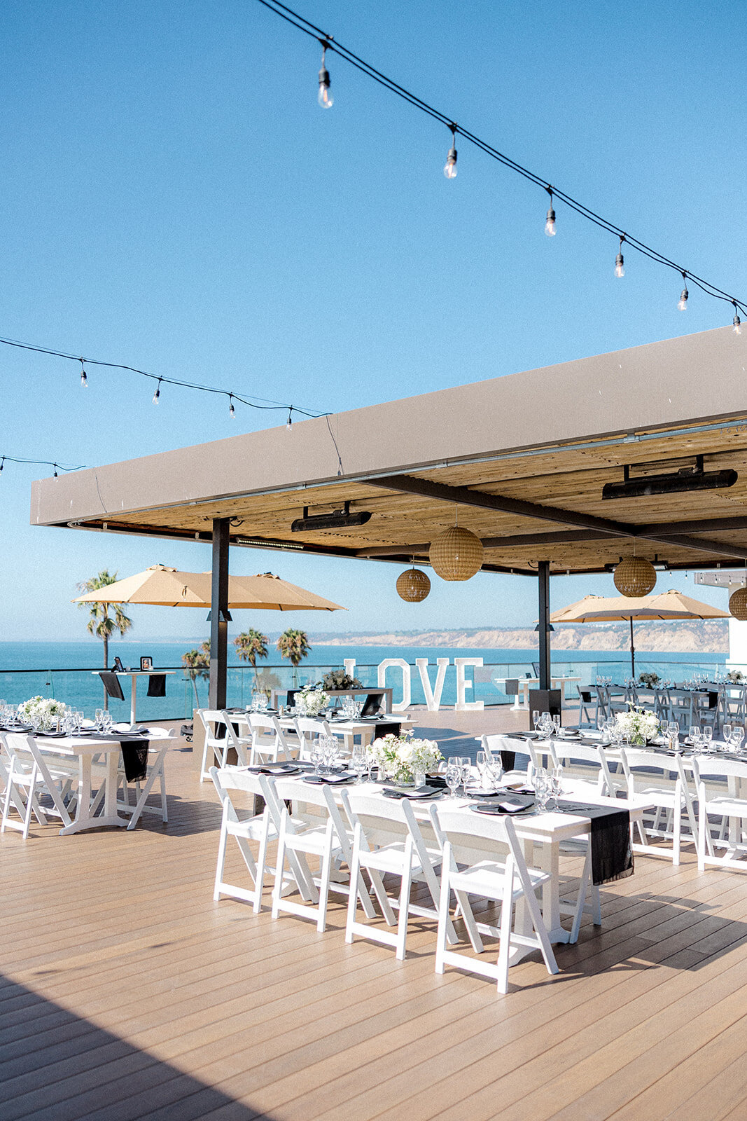 Wedding table scapes at San Diego Wedding with palm trees and ocean in the background