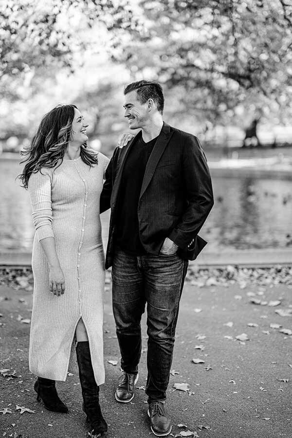 Couple walking through central park in fall