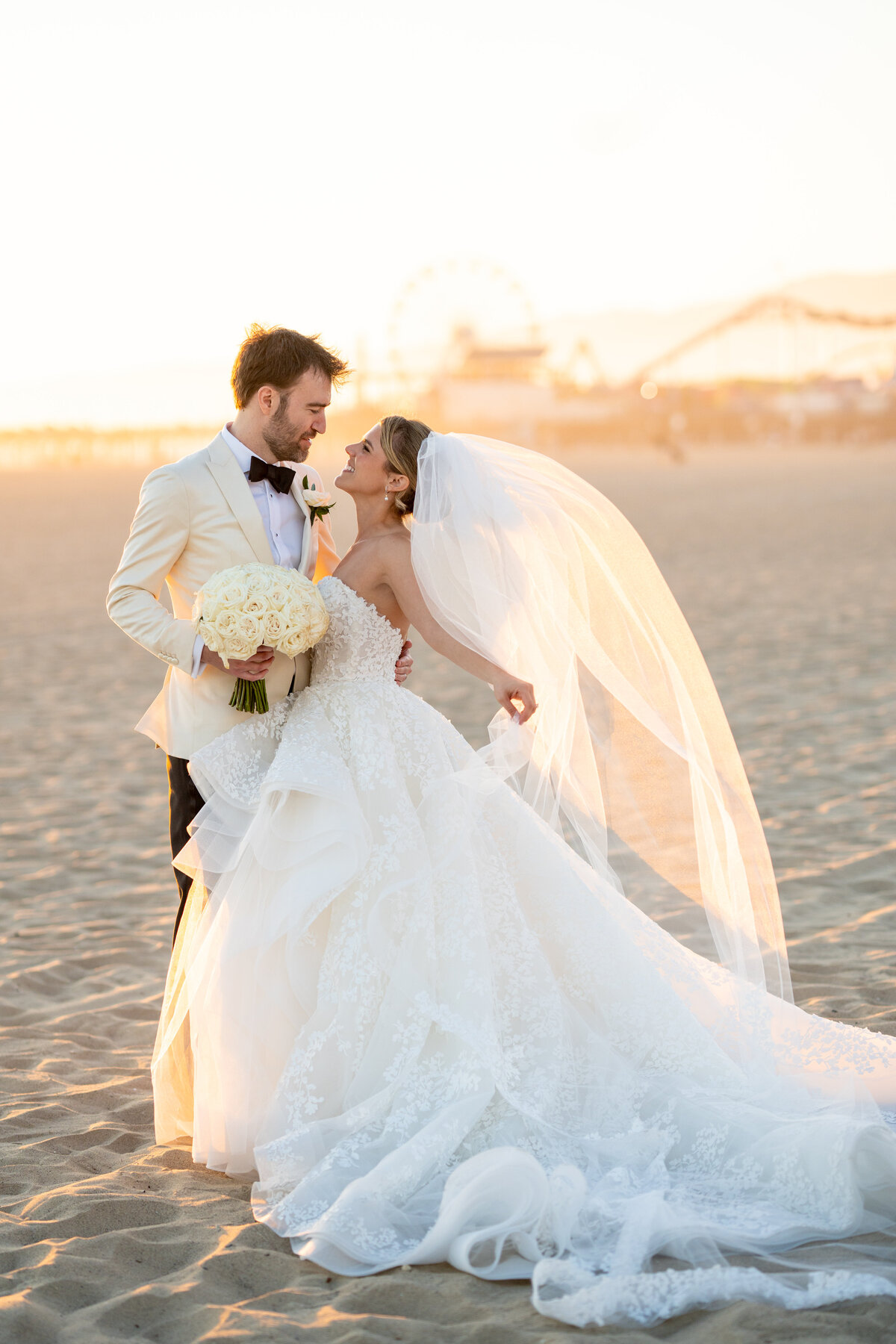 bride and groom on santa monica beach