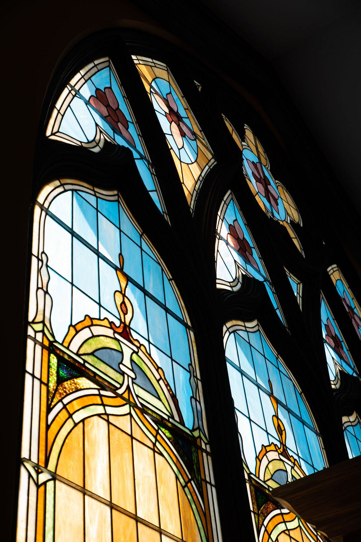 A close up of a stained glass window in a church