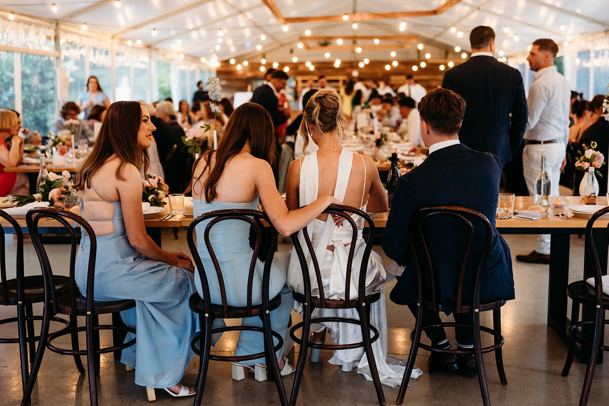 Wedding party seated during their reception at Poachers Pantry, Springrange NSW