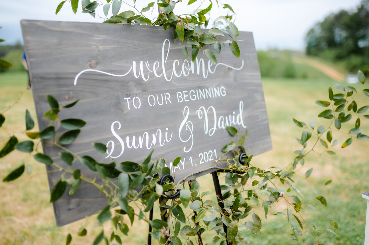 welcome sign to outdoor little rock ar wedding ceremony