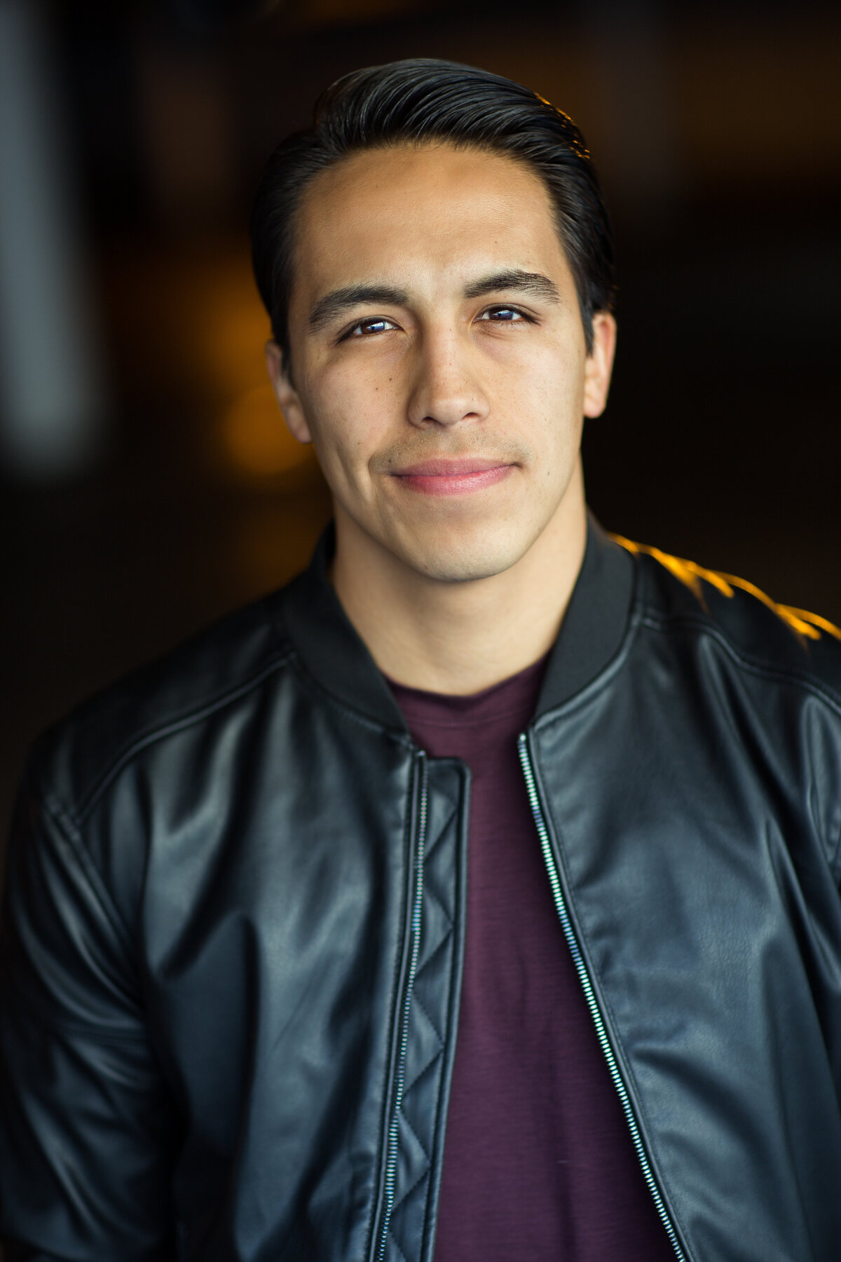 Headshot Photograph Of Young Man In Outer Black Leather Jacket And Inner Violet Shirt Los Angeles