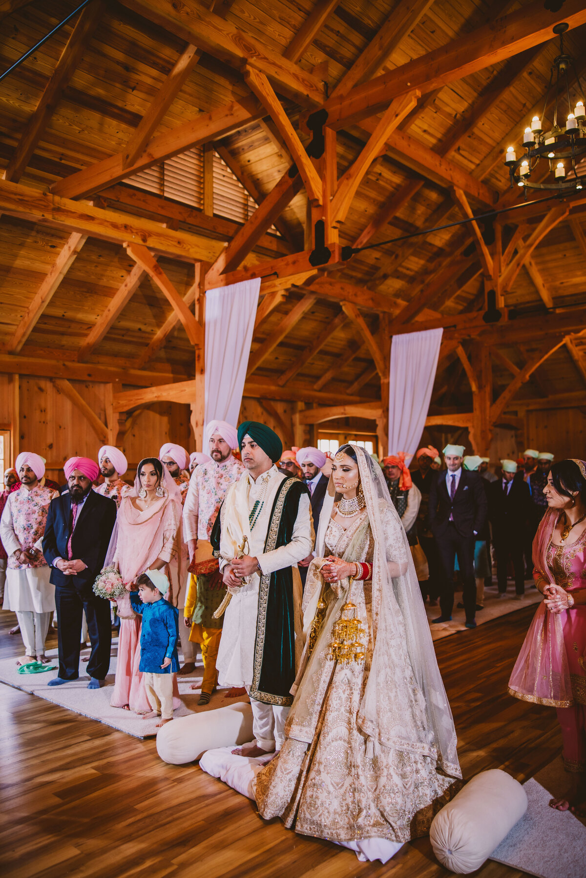 sikh bride and groom during the wedding ceremony in a wood cabin at brigalias nj