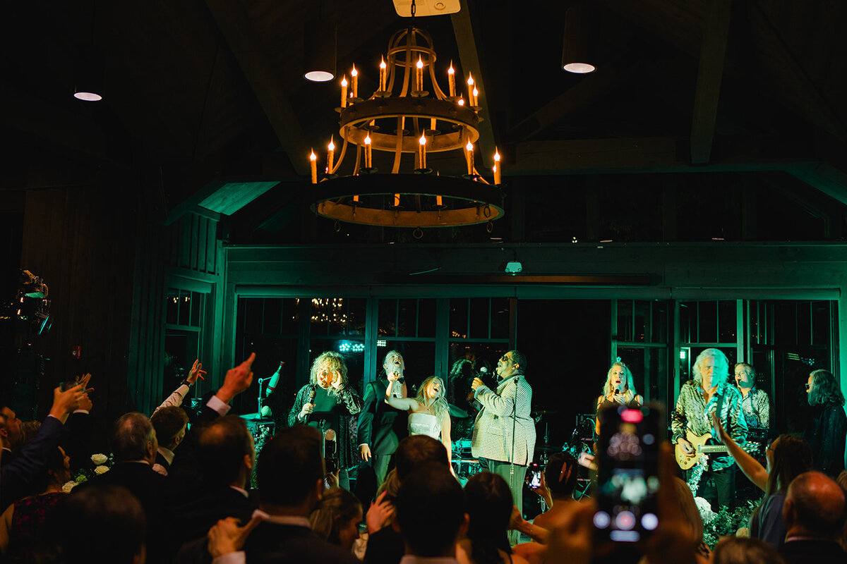 "Wedding reception with live band on stage and candlelit chandelier at a Highlands, North Carolina venue.