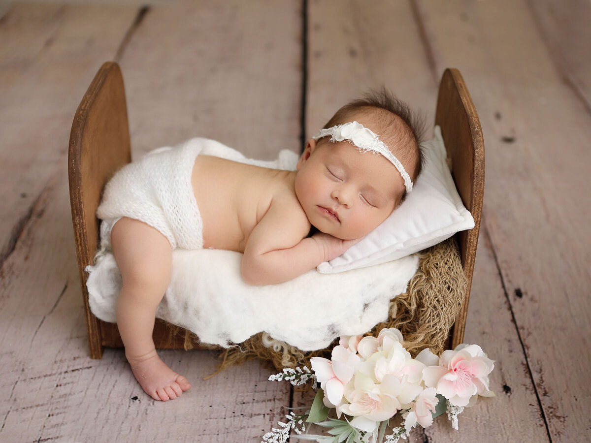 Newborn-photography-session-newborn-in-white-wrap-photo-taken-by-Janina-Botha-photographer-in-studio-in-Oakville-Ontario