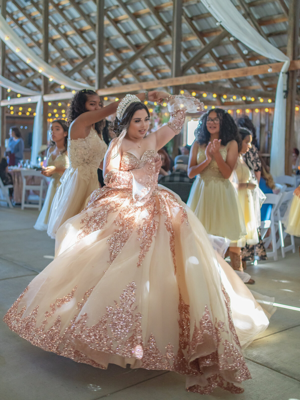 quinceañera dancing at the reception