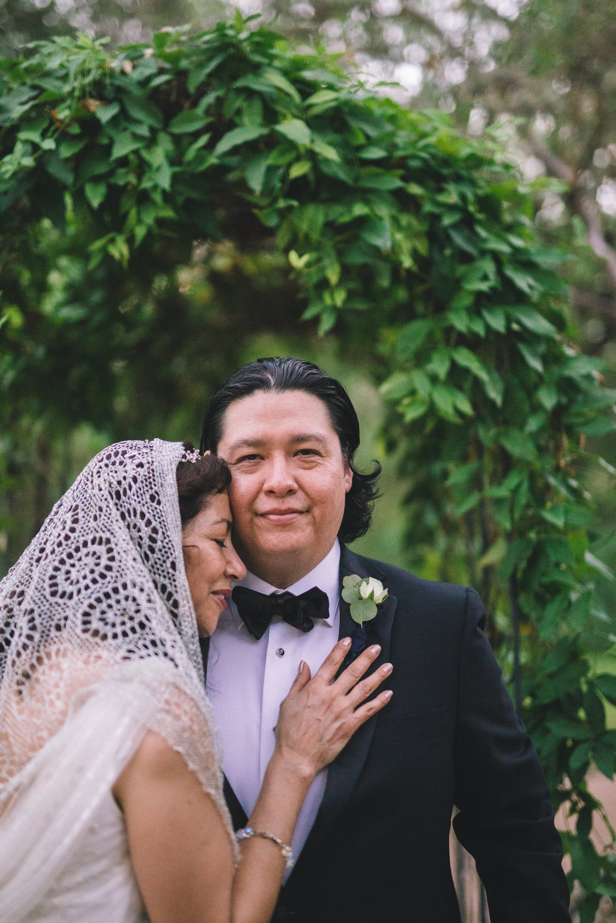 Bride posing with hand on grooms chest at The Veranda wedding venue by Expose the Heart San Antonio Wedding Photographer