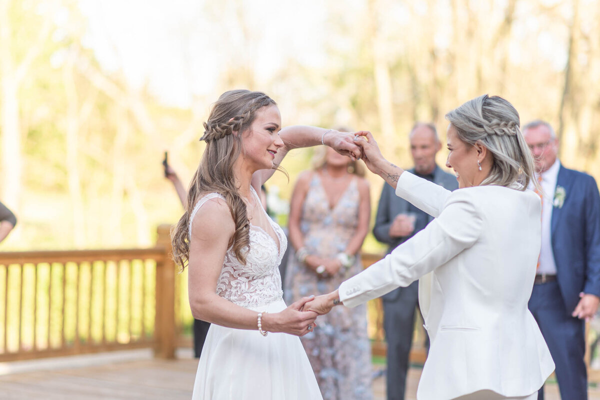 Couple dancing on deck of venue