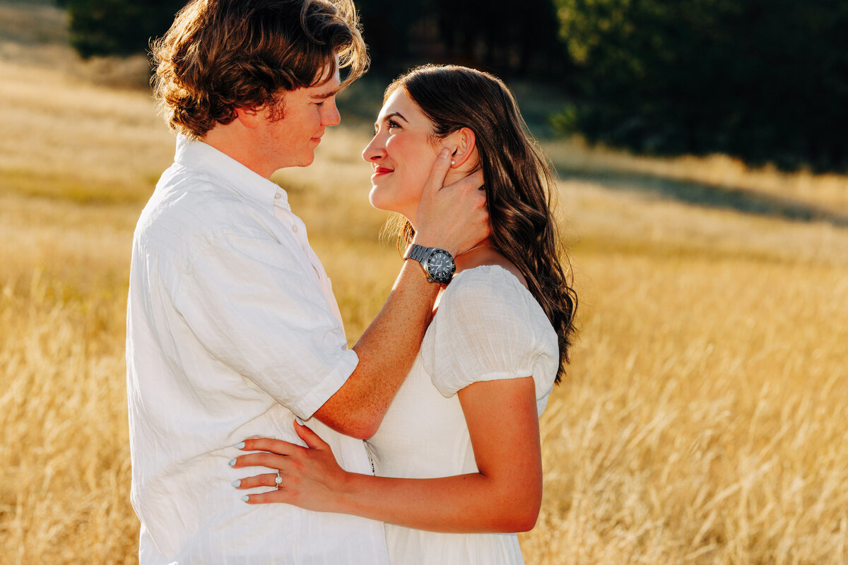 Engagement photo couple embracing at Blue Mountain in Missoula