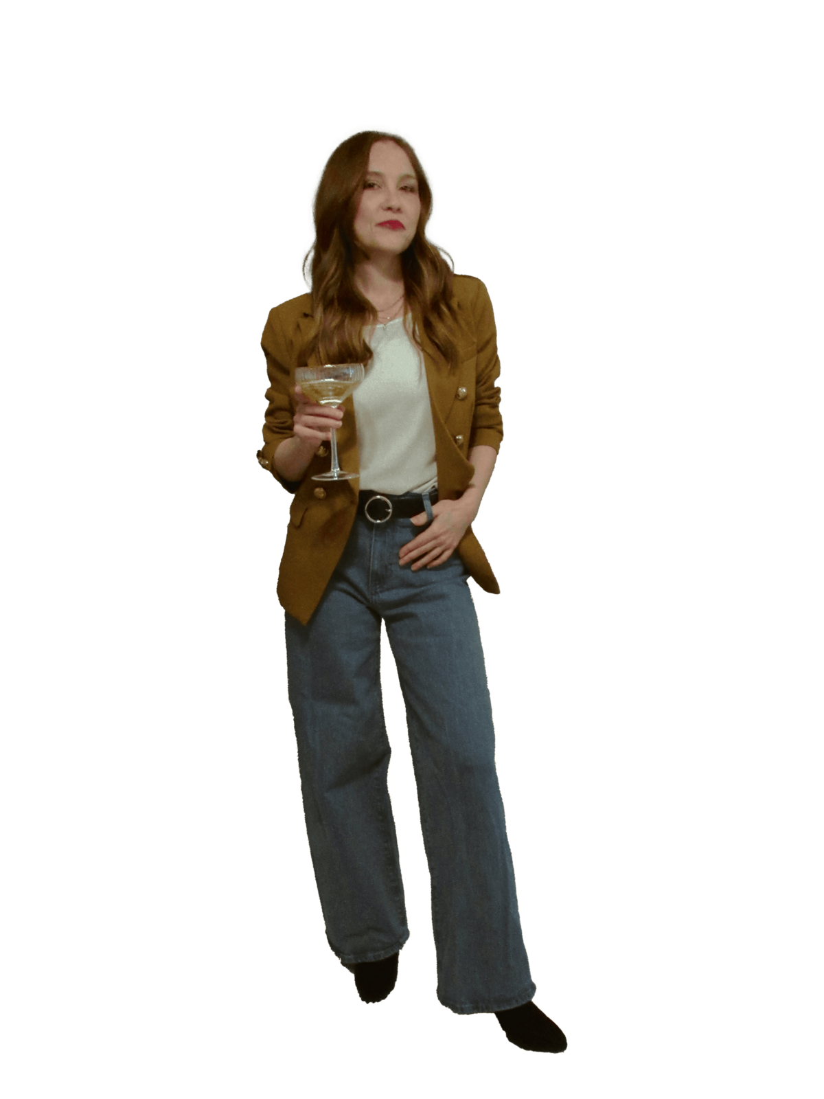 A Showit designer with long hair wearing a brown blazer, white top, and wide-leg jeans holds a wine glass and stands facing forward, an expert in small business branding.