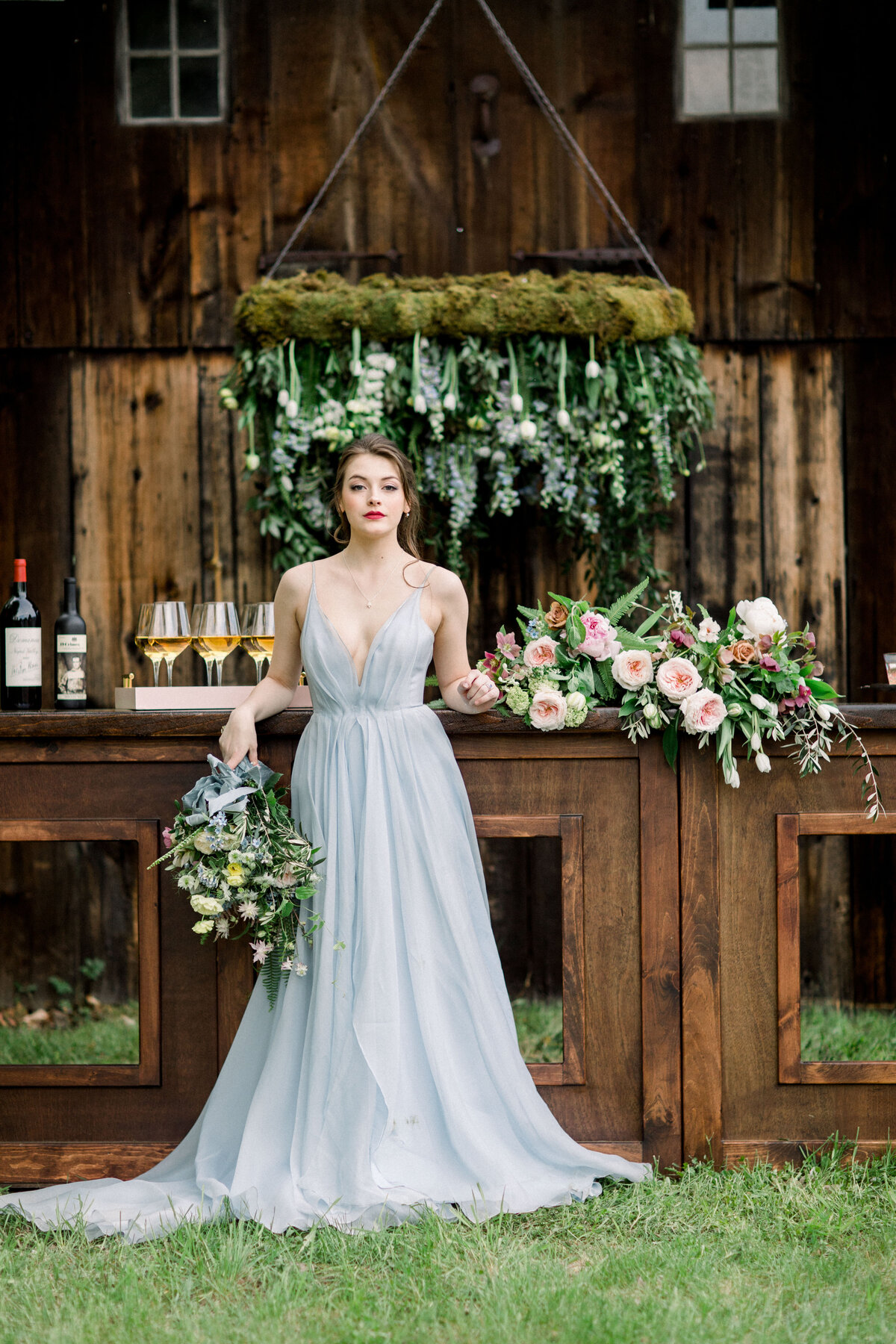 Bride standing in front of bar at The Estate at North Mowing