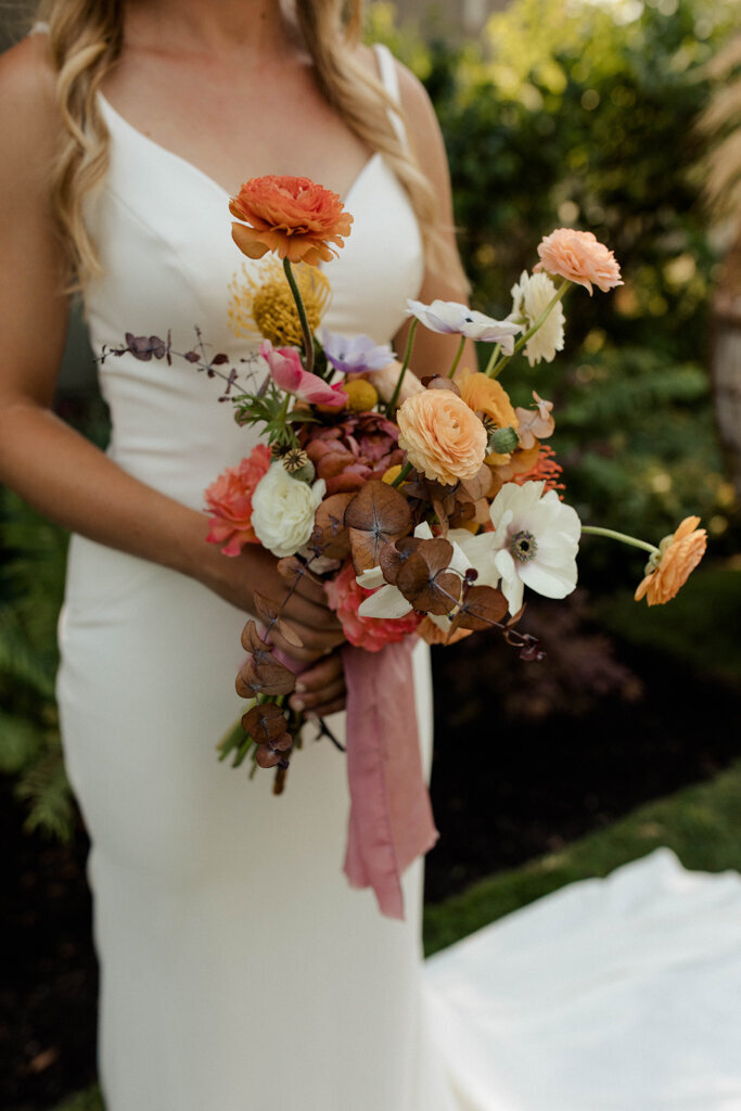 Fun and colourful bridal bouquet by J.A.M Florals, contemporary and playful Kelowna wedding florist, featured on the Brontë Bride Vendor Guide.