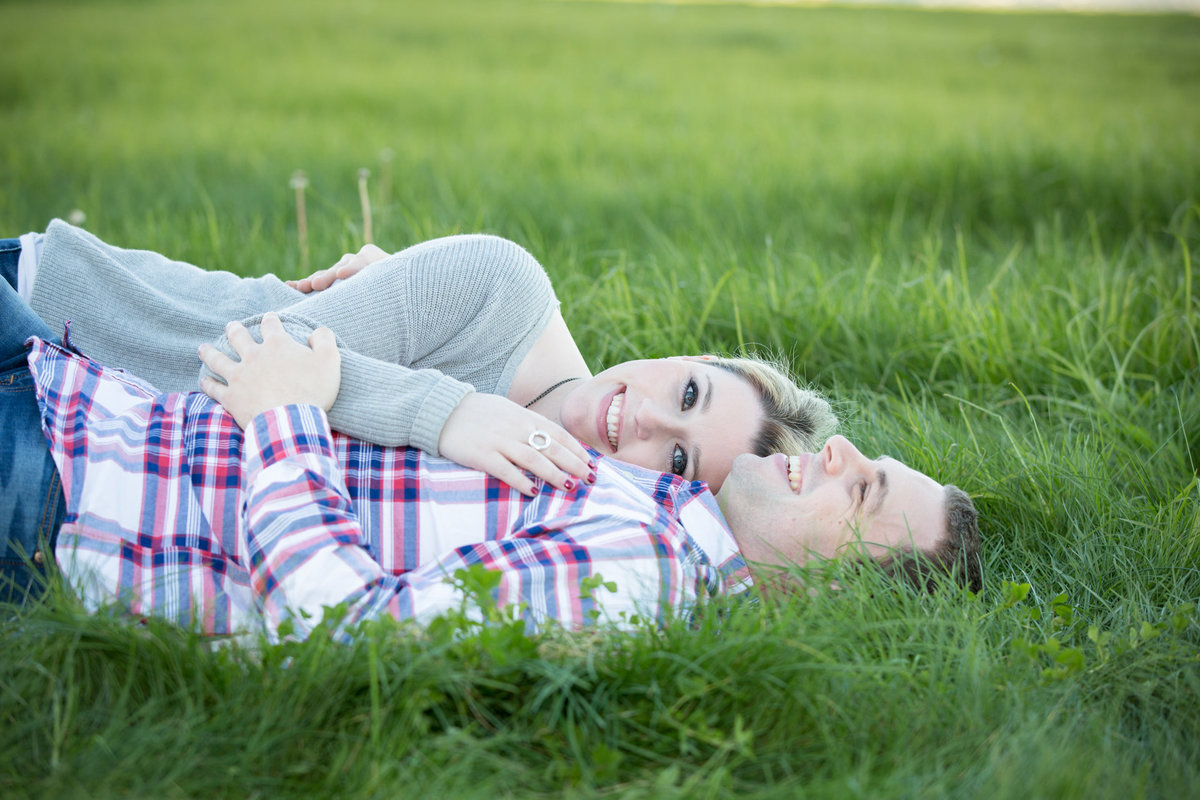 Engagement Photos in a Grass Field in San Francisco by the Golden Gate Bridge