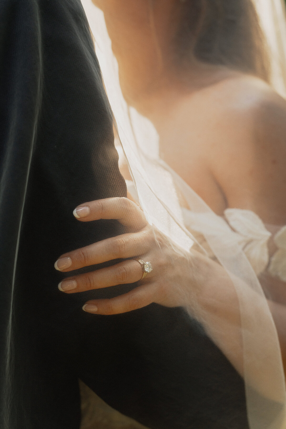 Photograph of rings on brides hand during her wedding portraits at Kitty Coleman Woodland Gardens in the Comox Valley by latitude 49 photography