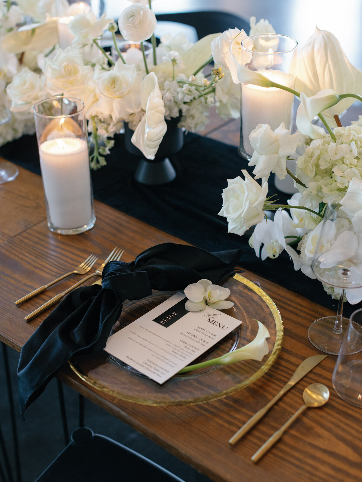 Classic with hint of modern black, white, and gold place setting. 