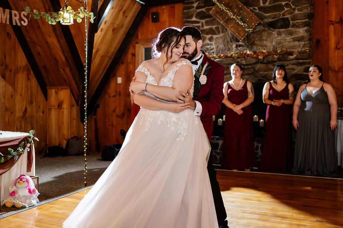 Bride and groom swaying in choreographed first dance at Pats Peek wedding in Henniker NH