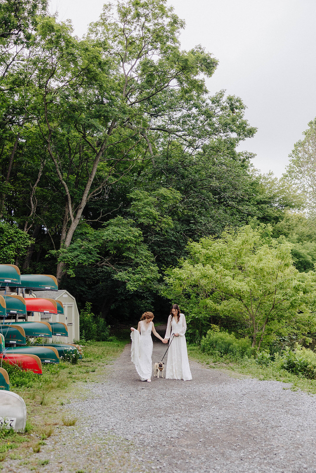 Brides walking along at Cornell University wedding