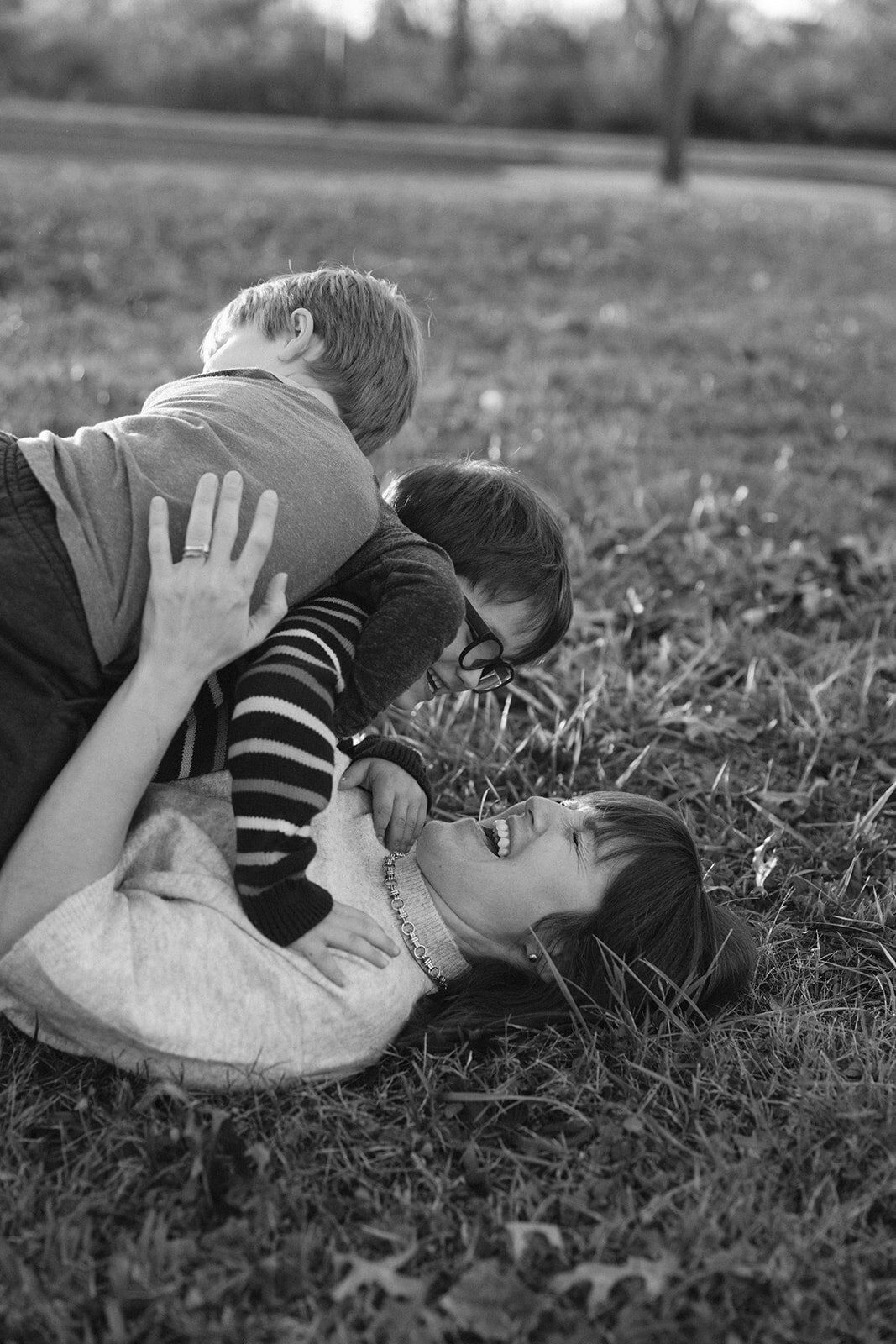 Mom and sons playing at Chimborazo State Park during RVA family photographer's photoshoot